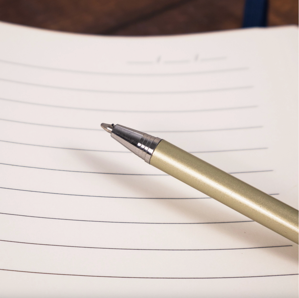 Pen on a sheet of lined paper
